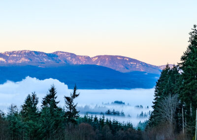 port alberni mountains with foggy rolling in valley